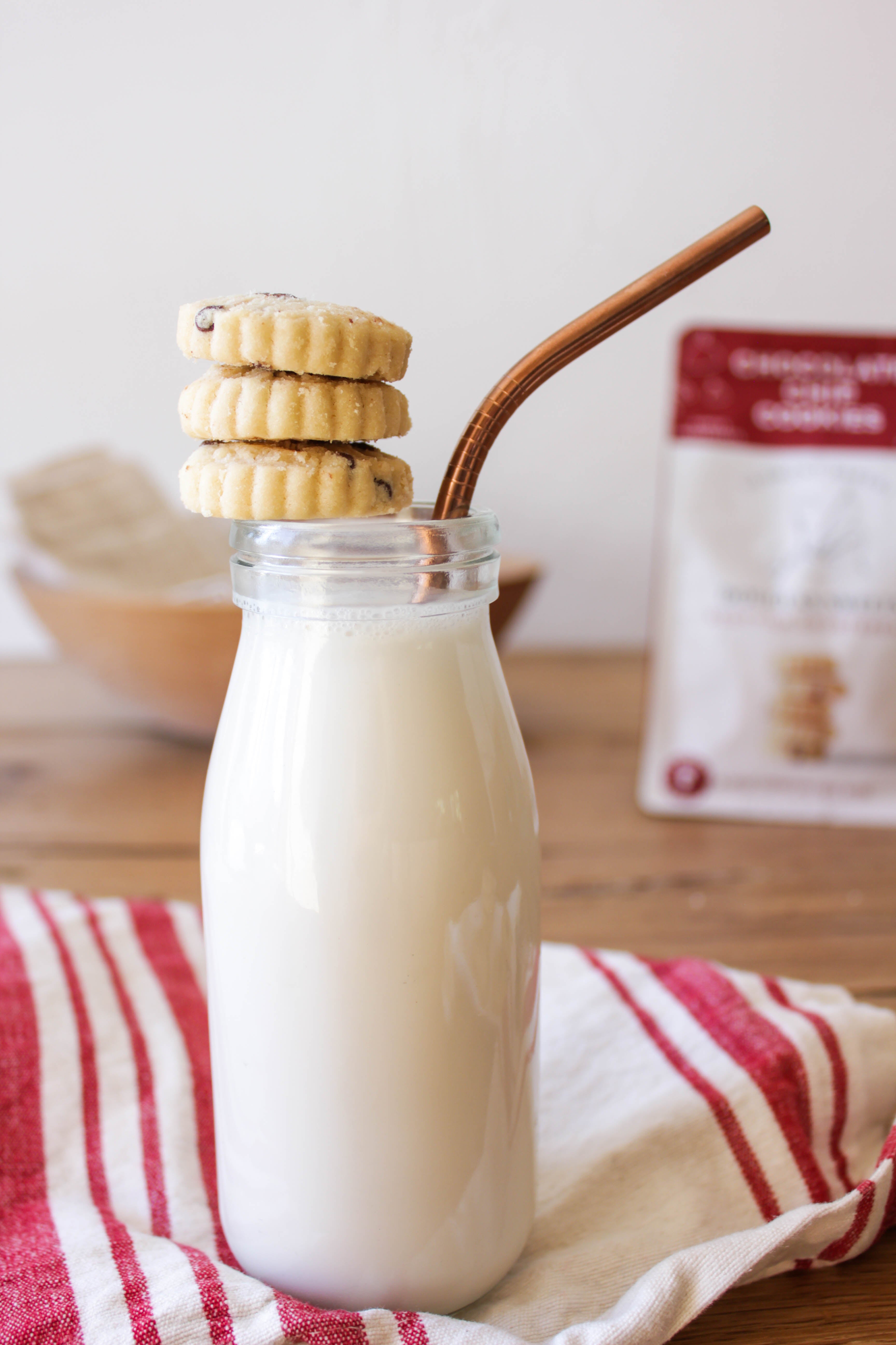 Douglas Sweets Chocolate Chip shortbread balanced on a glass of milk